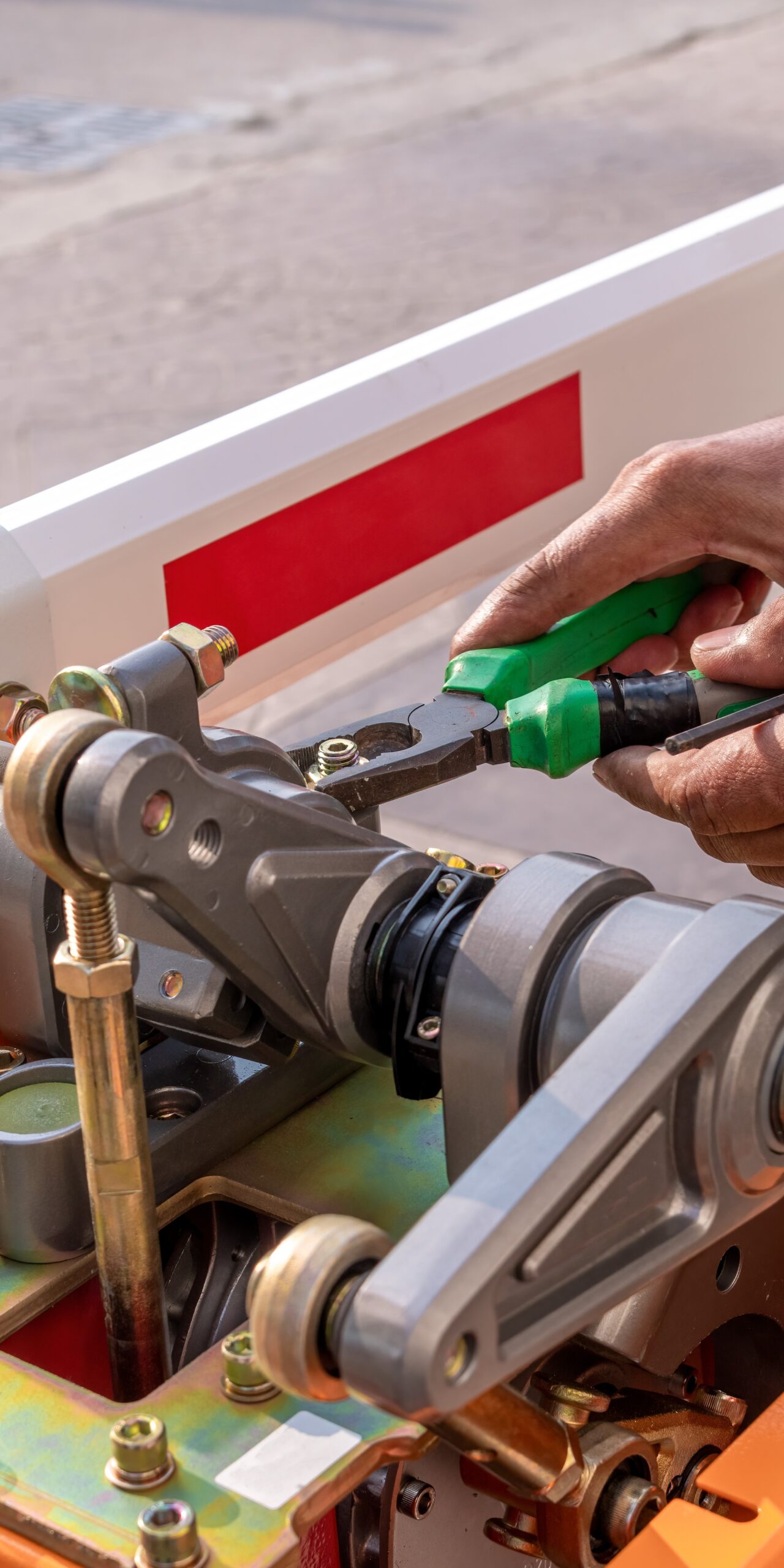 close-up-technician-assemble-barrier-gate-automati-2025-12-31-02-19-24-utc-2