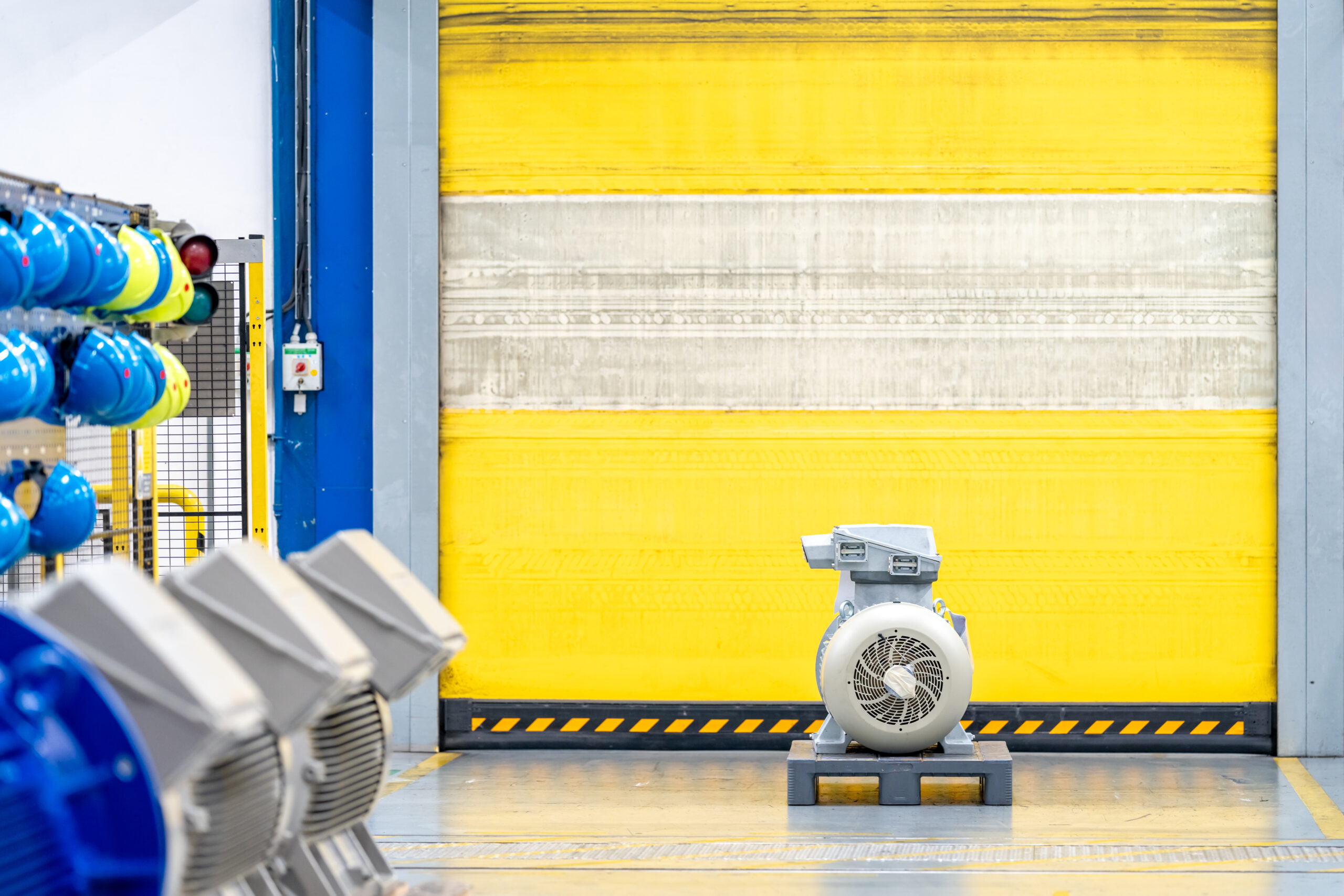 new modern electric motor on pallet in the warehouse. copy sapce